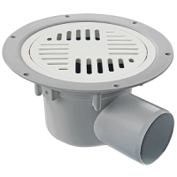 Rund golvbrunn i plast med slitsat metallock och utloppsrör på sidan.