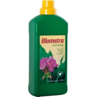 Grön VÄXTNÄRING BLOMSTRA 750ML flaska med gult lock och blomma på etiketten.