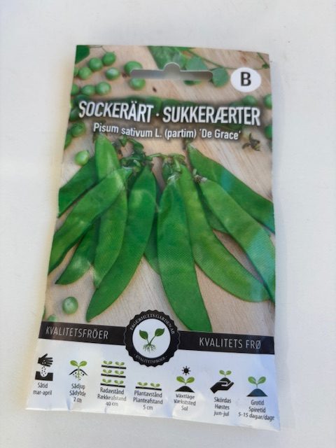Förpackning med Sockerärt ´De grace´-frön med bilder av gröna ärtskidor och ärtor.