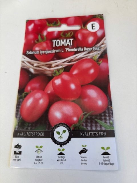 Paket med Tomat 'Plumbrella rosy pink' frön med bilder av små röda tomater och planteringsikoner.