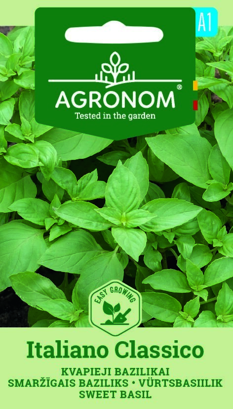 Paket med Basilika Italiano Classico-frön med frodiga gröna basilikablad i bakgrunden.