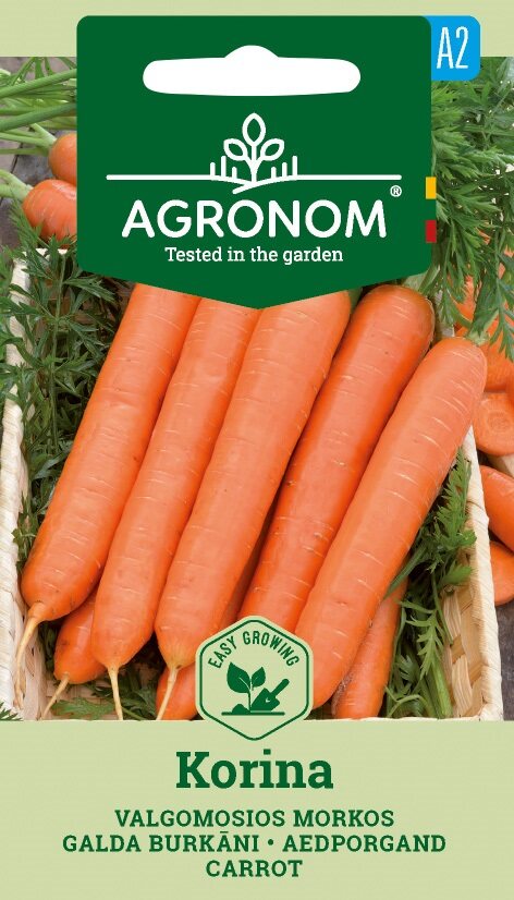 Färsk orange morot, Korina med gröna toppar på Agronom fröförpackning.