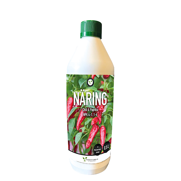 Chili/paprikanäring 0,5L i vit flaska med röd paprika på etiketten.