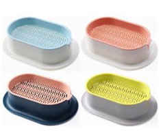 Fyra färgglada ovala tvålkoppar med räfflad yta i blått, rosa, gult och persika.