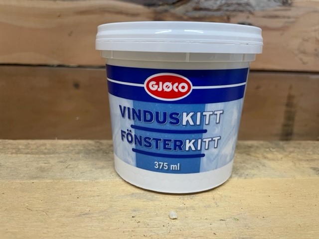 En 375 ml tub med Fönsterkitt Natur på en träyta.