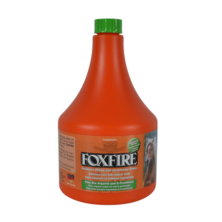 Orange flaska PÄLSGLANS FOXFIRE FELLGLANZ 1000 ML med en etikett med en hästbild.