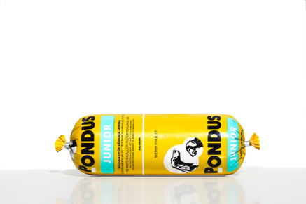 Gul och blå Pondus Junior (12 kg) djurfoderförpackning med hundbilder, mot vit bakgrund.