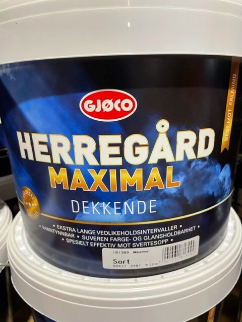 En färghink märkt Maximal sort 9LITER med blå och guld text.