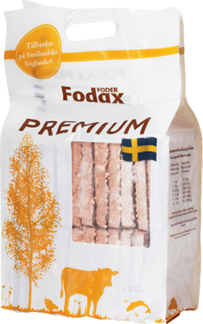 Påse Fodax Premium djurfoder med illustrationer av en orange ko och ett träd samt en svensk flagga.
