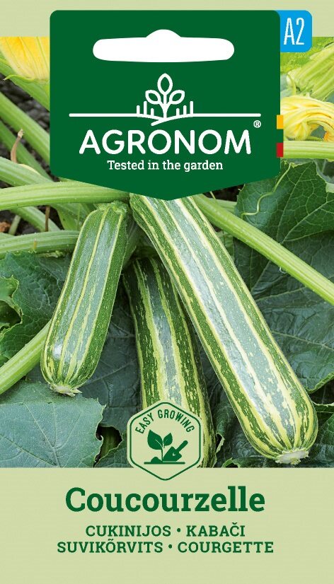 Förpackning med Squash, Coucourzelle-frön med randiga gröna zucchinis och frodiga gröna blad.