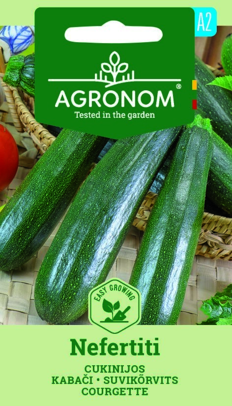 Tre färska Squash, Nefertiti på en korgmatta med märkt fröförpackning.