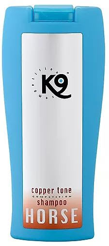 Blå flaska med COPPER TONE SHAMPOO för hästar med vit och orange etikett.