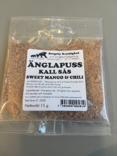 Änglapuss Kall sås Sweet Mango & Chili 15g förpackning på en grå yta.