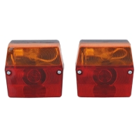 Två BAKLAMPA ASPÖCK MINIPOINT99X93 bakljus, röda & gula, sida vid sida på vit botten.