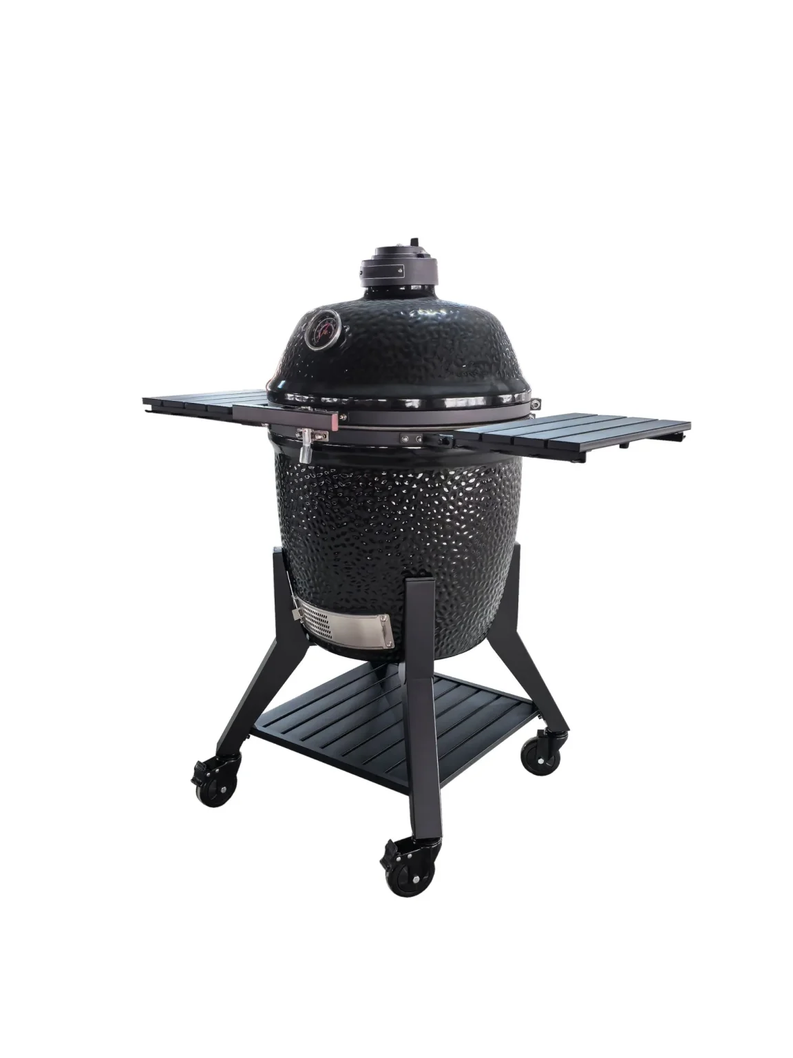 Svart keramisk kamadogrill på hjul med fällbara sidohyllor och ventilerat lock.
